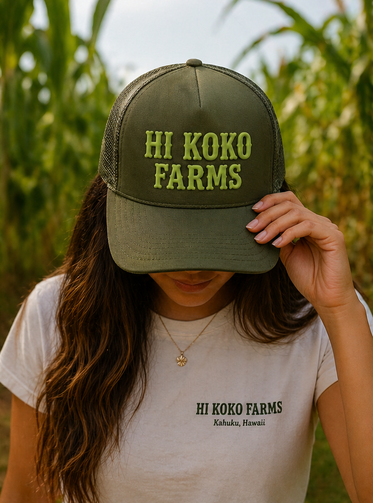 HI KOKO FARMS green Trucker Hat worn on the farm